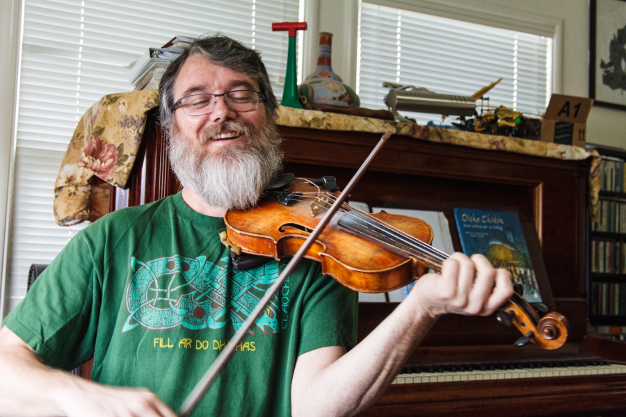 Galt Barber playing his fiddle at home in Santa Cruz, California. Galt Barber playing his fiddle at home in Santa Cruz, California.